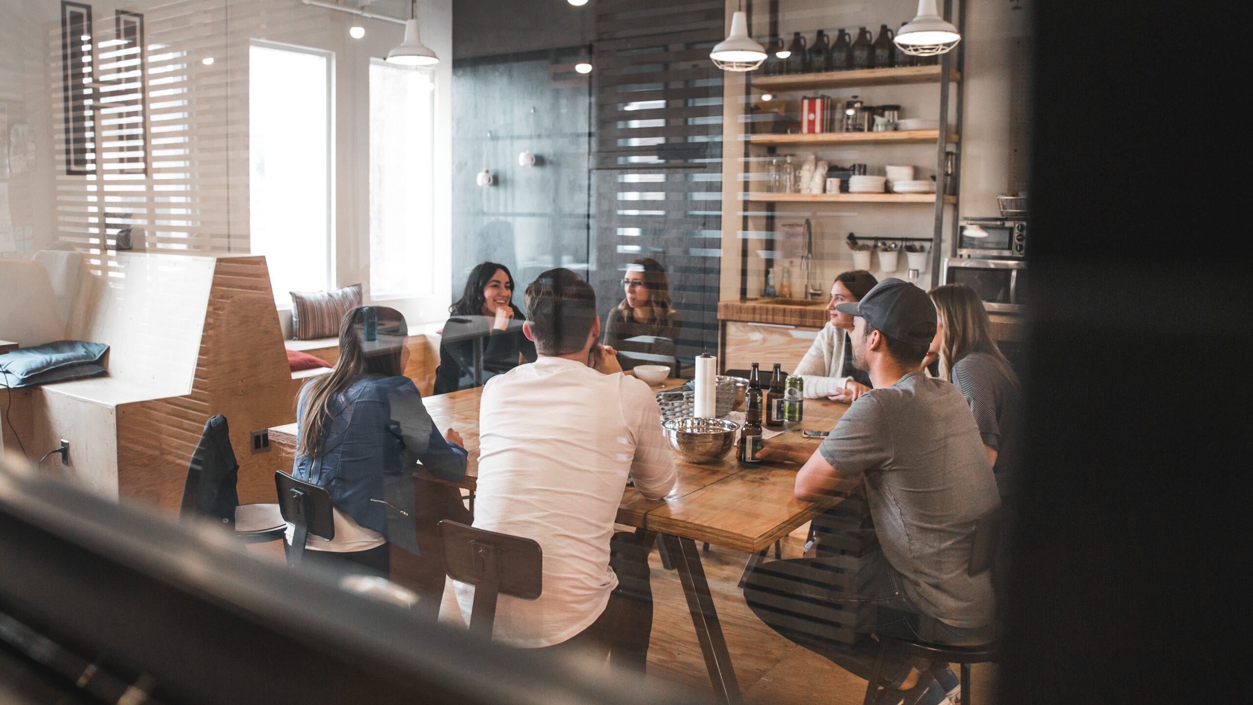 Restaurant team discussing Axial Shift's latest contest in their pre-shift meeting.