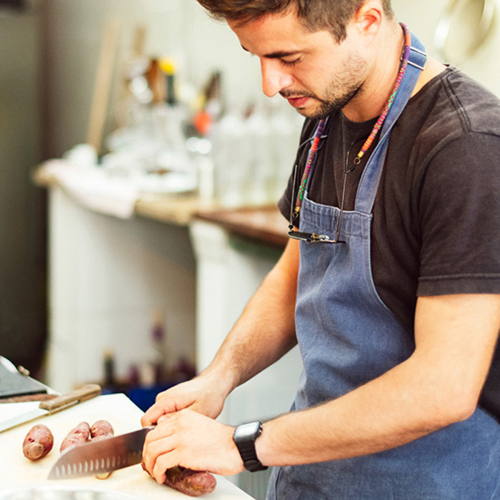 Chef Cook working in kitchen of restaurant